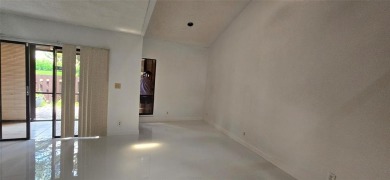 Lovely townhome. It features fresh paint, new porcelain tile on on Woodmont Country Club in Florida - for sale on GolfHomes.com, golf home, golf lot