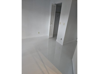 Lovely townhome. It features fresh paint, new porcelain tile on on Woodmont Country Club in Florida - for sale on GolfHomes.com, golf home, golf lot