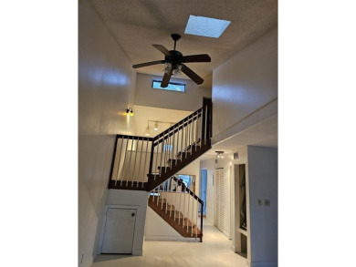 Lovely townhome. It features fresh paint, new porcelain tile on on Woodmont Country Club in Florida - for sale on GolfHomes.com, golf home, golf lot