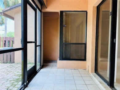 Lovely townhome. It features fresh paint, new porcelain tile on on Woodmont Country Club in Florida - for sale on GolfHomes.com, golf home, golf lot