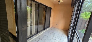 Lovely townhome. It features fresh paint, new porcelain tile on on Woodmont Country Club in Florida - for sale on GolfHomes.com, golf home, golf lot