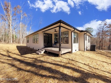 This stunning 3-bedroom, 2.5-bath Prairie-style custom home on Druid Hills Golf Club in Tennessee - for sale on GolfHomes.com, golf home, golf lot