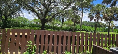 Lovely townhome. It features fresh paint, new porcelain tile on on Woodmont Country Club in Florida - for sale on GolfHomes.com, golf home, golf lot
