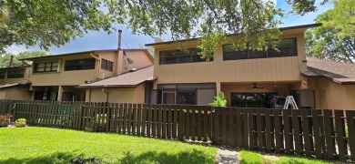 Lovely townhome. It features fresh paint, new porcelain tile on on Woodmont Country Club in Florida - for sale on GolfHomes.com, golf home, golf lot