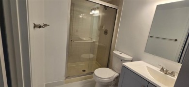 Lovely townhome. It features fresh paint, new porcelain tile on on Woodmont Country Club in Florida - for sale on GolfHomes.com, golf home, golf lot