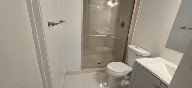 Lovely townhome. It features fresh paint, new porcelain tile on on Woodmont Country Club in Florida - for sale on GolfHomes.com, golf home, golf lot