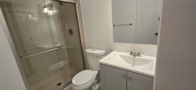 Lovely townhome. It features fresh paint, new porcelain tile on on Woodmont Country Club in Florida - for sale on GolfHomes.com, golf home, golf lot