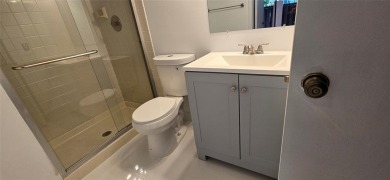 Lovely townhome. It features fresh paint, new porcelain tile on on Woodmont Country Club in Florida - for sale on GolfHomes.com, golf home, golf lot