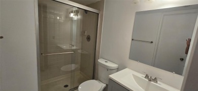 Lovely townhome. It features fresh paint, new porcelain tile on on Woodmont Country Club in Florida - for sale on GolfHomes.com, golf home, golf lot