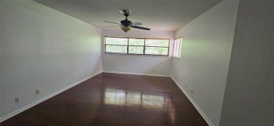 Lovely townhome. It features fresh paint, new porcelain tile on on Woodmont Country Club in Florida - for sale on GolfHomes.com, golf home, golf lot