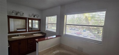 Lovely townhome. It features fresh paint, new porcelain tile on on Woodmont Country Club in Florida - for sale on GolfHomes.com, golf home, golf lot