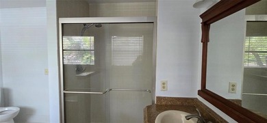 Lovely townhome. It features fresh paint, new porcelain tile on on Woodmont Country Club in Florida - for sale on GolfHomes.com, golf home, golf lot