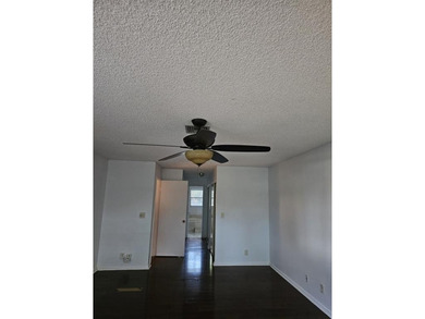 Lovely townhome. It features fresh paint, new porcelain tile on on Woodmont Country Club in Florida - for sale on GolfHomes.com, golf home, golf lot