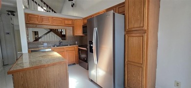 Lovely townhome. It features fresh paint, new porcelain tile on on Woodmont Country Club in Florida - for sale on GolfHomes.com, golf home, golf lot