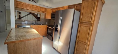 Lovely townhome. It features fresh paint, new porcelain tile on on Woodmont Country Club in Florida - for sale on GolfHomes.com, golf home, golf lot