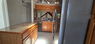 Lovely townhome. It features fresh paint, new porcelain tile on on Woodmont Country Club in Florida - for sale on GolfHomes.com, golf home, golf lot