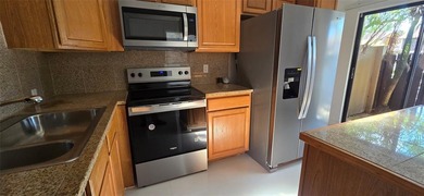 Lovely townhome. It features fresh paint, new porcelain tile on on Woodmont Country Club in Florida - for sale on GolfHomes.com, golf home, golf lot