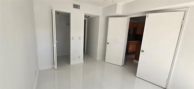 Lovely townhome. It features fresh paint, new porcelain tile on on Woodmont Country Club in Florida - for sale on GolfHomes.com, golf home, golf lot