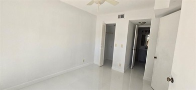Lovely townhome. It features fresh paint, new porcelain tile on on Woodmont Country Club in Florida - for sale on GolfHomes.com, golf home, golf lot