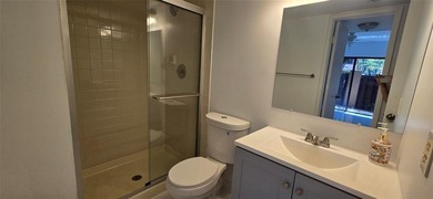 Lovely townhome. It features fresh paint, new porcelain tile on on Woodmont Country Club in Florida - for sale on GolfHomes.com, golf home, golf lot