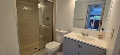 Lovely townhome. It features fresh paint, new porcelain tile on on Woodmont Country Club in Florida - for sale on GolfHomes.com, golf home, golf lot