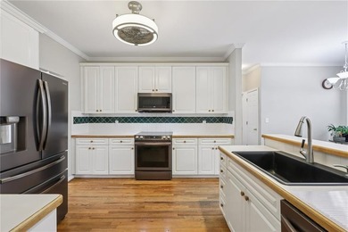 Nestled on a rare, just-under-an-acre lot at the end of a quiet on Collins Hill Golf Club in Georgia - for sale on GolfHomes.com, golf home, golf lot