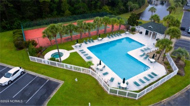 Stunning Sunset Village condo in Sandpiper Bay. This unit has on Sandpiper Bay Golf and Country Club in North Carolina - for sale on GolfHomes.com, golf home, golf lot