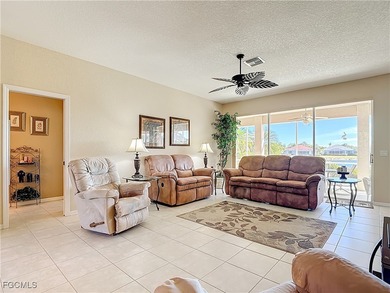 This beautifully maintained LAKEFRONT Sandpiper model home in on Herons Glen Golf and Country Club in Florida - for sale on GolfHomes.com, golf home, golf lot