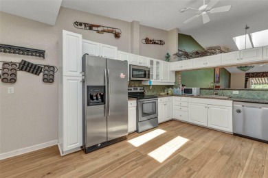 This stunning three-bedroom, two-bath freestanding villa is on Twin Isles Country Club in Florida - for sale on GolfHomes.com, golf home, golf lot