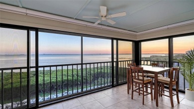 Enjoy elevated, front-row sunset views from this top-floor on IMG Academies Golf and Country Club in Florida - for sale on GolfHomes.com, golf home, golf lot