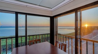 Enjoy elevated, front-row sunset views from this top-floor on IMG Academies Golf and Country Club in Florida - for sale on GolfHomes.com, golf home, golf lot