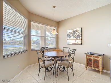 This beautifully maintained LAKEFRONT Sandpiper model home in on Herons Glen Golf and Country Club in Florida - for sale on GolfHomes.com, golf home, golf lot