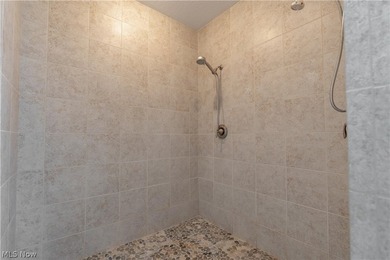 This beautifully maintained 3-bedroom, 3-bath ranch backs on Oak Shadows Golf Club in Ohio - for sale on GolfHomes.com, golf home, golf lot