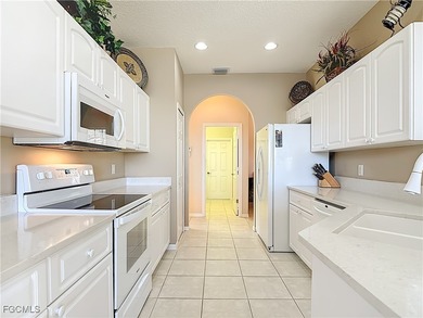 This beautifully maintained LAKEFRONT Sandpiper model home in on Herons Glen Golf and Country Club in Florida - for sale on GolfHomes.com, golf home, golf lot