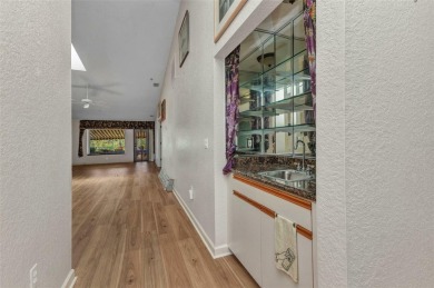 This stunning three-bedroom, two-bath freestanding villa is on Twin Isles Country Club in Florida - for sale on GolfHomes.com, golf home, golf lot