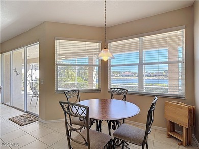 This beautifully maintained LAKEFRONT Sandpiper model home in on Herons Glen Golf and Country Club in Florida - for sale on GolfHomes.com, golf home, golf lot