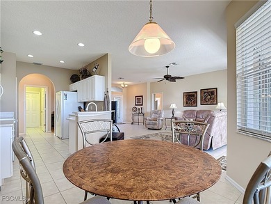 This beautifully maintained LAKEFRONT Sandpiper model home in on Herons Glen Golf and Country Club in Florida - for sale on GolfHomes.com, golf home, golf lot