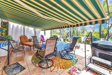 This stunning three-bedroom, two-bath freestanding villa is on Twin Isles Country Club in Florida - for sale on GolfHomes.com, golf home, golf lot