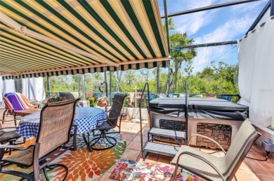 This stunning three-bedroom, two-bath freestanding villa is on Twin Isles Country Club in Florida - for sale on GolfHomes.com, golf home, golf lot