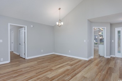Nestled in the vibrant 55+ community of Myrtle Trace, this on Burning Ridge Golf Course in South Carolina - for sale on GolfHomes.com, golf home, golf lot