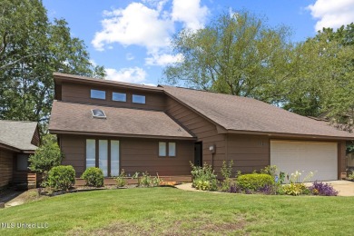 This mid-century modern home has been tastefully updated while on Colonial Country Club Deerfield in Mississippi - for sale on GolfHomes.com, golf home, golf lot