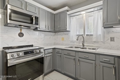 This mid-century modern home has been tastefully updated while on Colonial Country Club Deerfield in Mississippi - for sale on GolfHomes.com, golf home, golf lot