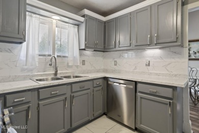 This mid-century modern home has been tastefully updated while on Colonial Country Club Deerfield in Mississippi - for sale on GolfHomes.com, golf home, golf lot