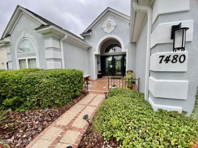 STUNNING HOME WITH WATER & GOLF COURSE VIEWS-YOUR EVERYDAY on Sandpiper Bay Golf and Country Club in North Carolina - for sale on GolfHomes.com, golf home, golf lot