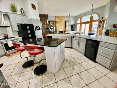 STUNNING HOME WITH WATER & GOLF COURSE VIEWS-YOUR EVERYDAY on Sandpiper Bay Golf and Country Club in North Carolina - for sale on GolfHomes.com, golf home, golf lot