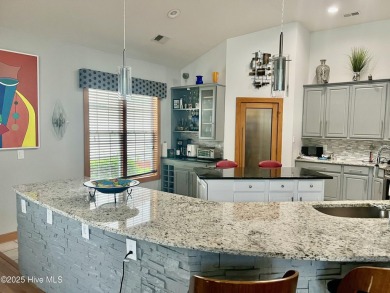 STUNNING HOME WITH WATER & GOLF COURSE VIEWS-YOUR EVERYDAY on Sandpiper Bay Golf and Country Club in North Carolina - for sale on GolfHomes.com, golf home, golf lot