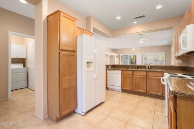 Resort-style living in one of Sun City Grand's most sought-after on Sun City Grand Golf Couse and Club in Arizona - for sale on GolfHomes.com, golf home, golf lot