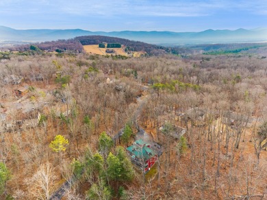 Discover elevated mountain living at 175 Cub Lane, a refined on Woodstone Meadows Golf Course At Massanutten in Virginia - for sale on GolfHomes.com, golf home, golf lot