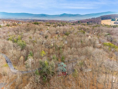 Discover elevated mountain living at 175 Cub Lane, a refined on Woodstone Meadows Golf Course At Massanutten in Virginia - for sale on GolfHomes.com, golf home, golf lot