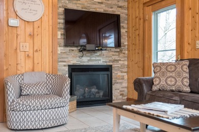 Discover elevated mountain living at 175 Cub Lane, a refined on Woodstone Meadows Golf Course At Massanutten in Virginia - for sale on GolfHomes.com, golf home, golf lot